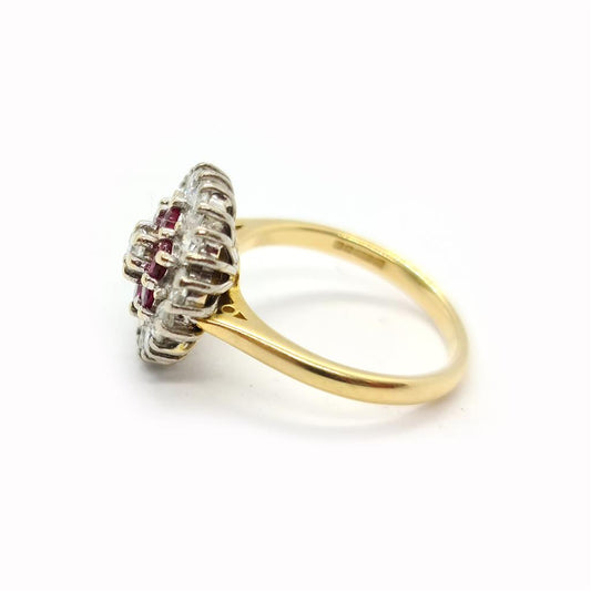 18ct yellow gold ring featuring 1.18ct diamond and 0.36ct ruby, size K, with a sleek and elegant design.