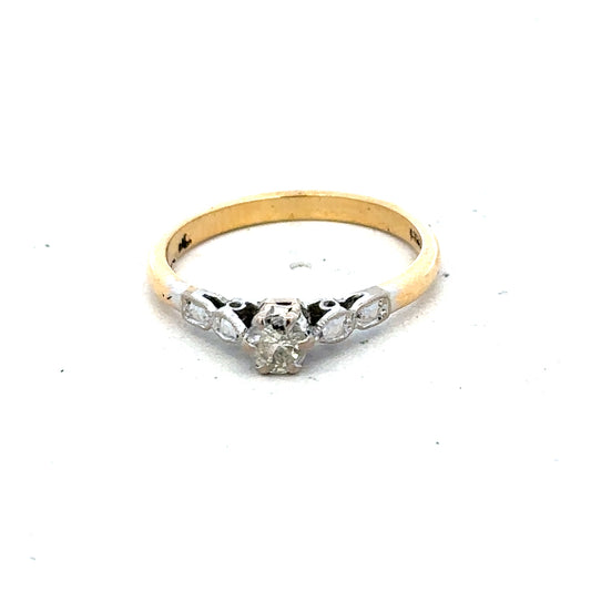 18ct yellow gold and platinum diamond ring in size M, featuring a sparkling diamond and elegant design.