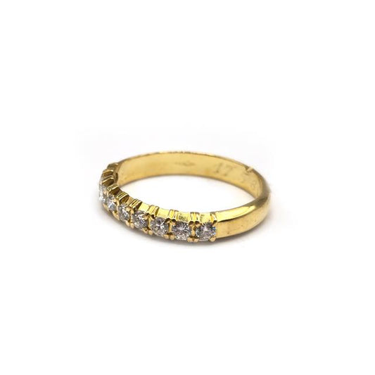 18ct yellow gold half eternity diamond ring with sparkling side stones, designed for elegant beauty and timeless style.