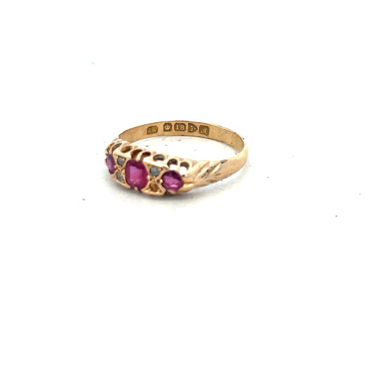 18ct yellow gold ruby and diamond ring, size P, featuring a central ruby gemstone surrounded by sparkling diamonds.