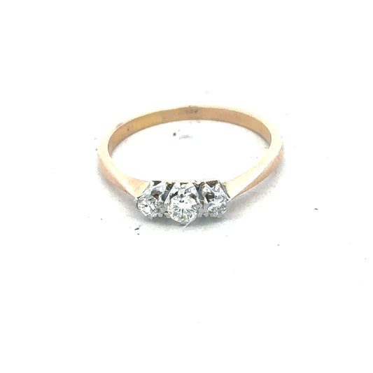18ct yellow gold three diamond ring with a polished band, showcasing sparkling diamonds set in a classic design.