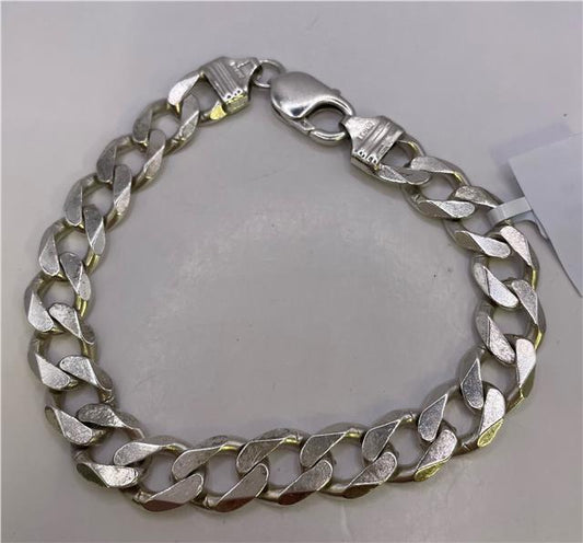 Sterling silver bracelet with intricate design, unbranded, featuring polished links and detailed craftsmanship.