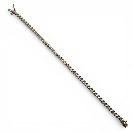 9ct diamond line bracelet with sparkling diamonds on a sleek gold chain, unbranded jewelry piece for elegant style.
