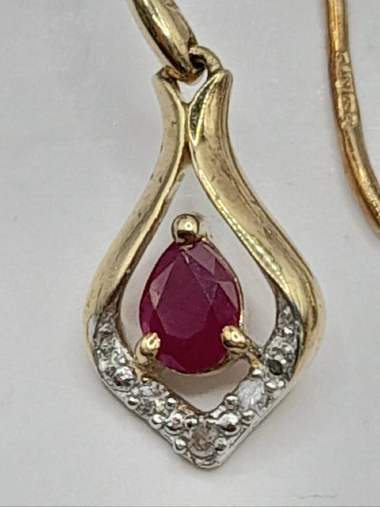9ct gold Ruby earrings featuring vibrant red rubies set in gold, showcasing elegant jewelry design.