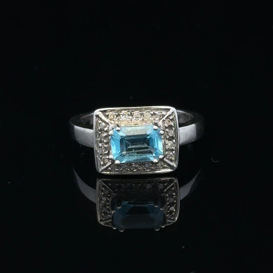 9ct white gold diamond ring in size L, featuring a sparkling central diamond and intricate band design.