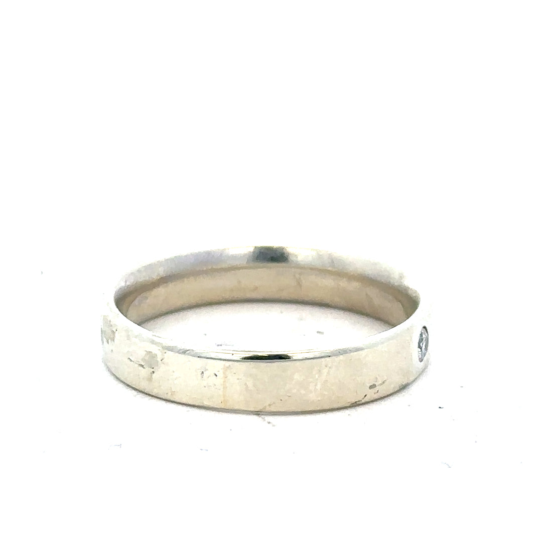 9ct white gold diamond ring in size V with sparkling diamonds, showcasing a sleek and elegant jewelry design.