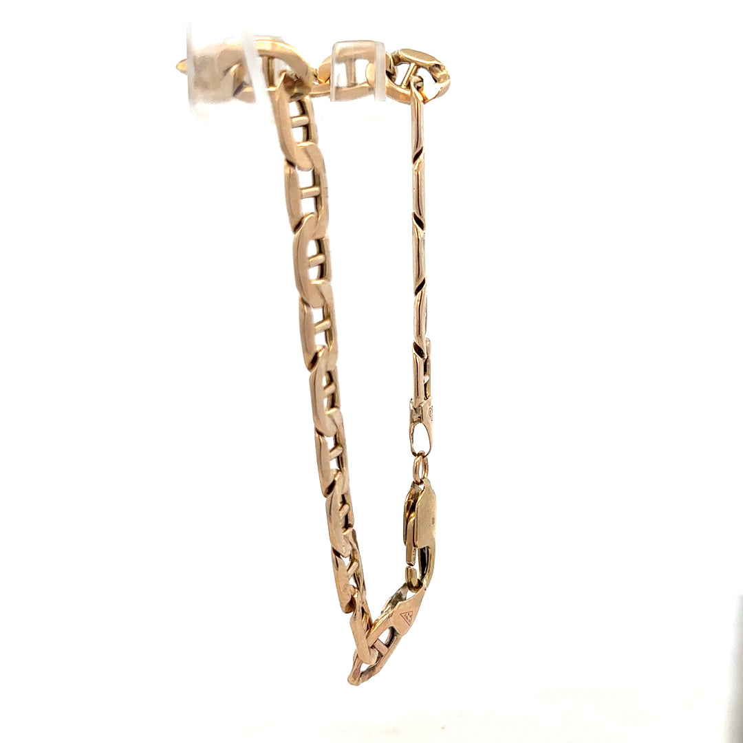 9ct yellow gold bracelet, unbranded, with a sleek design and 8.6g weight, shown in a close-up image.