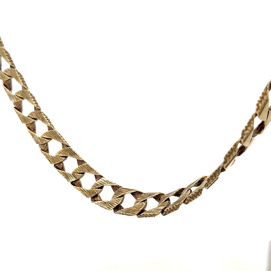 9ct yellow gold chain weighing 61.2g, unbranded jewelry with a detailed close-up of its elegant design and polished finish.