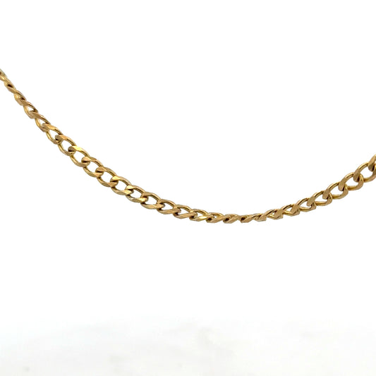 9ct yellow gold chain weighing 7.4g, unbranded jewelry piece with a classic design, displayed against a neutral background.