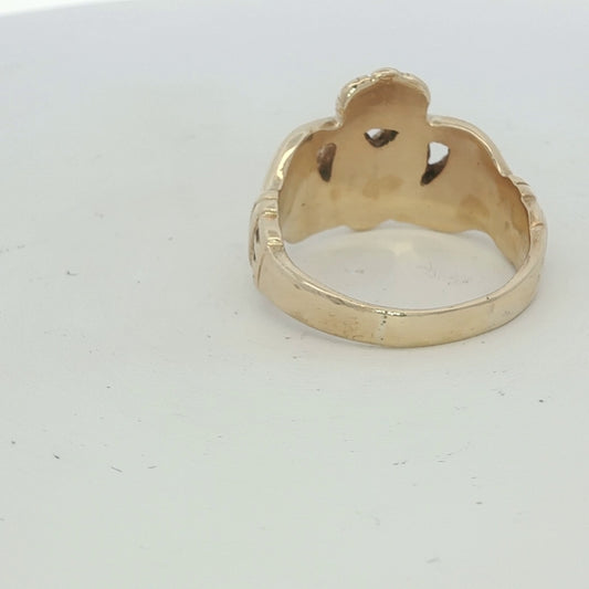 9ct yellow gold Claddagh ring with intricate heart and crown design, showcasing detailed craftsmanship and classic Irish symbolism.