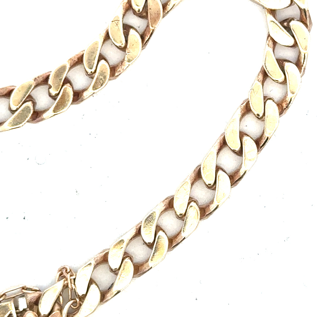 9ct yellow gold curb bracelet weighing 20g, unbranded, with a classic linked chain design.