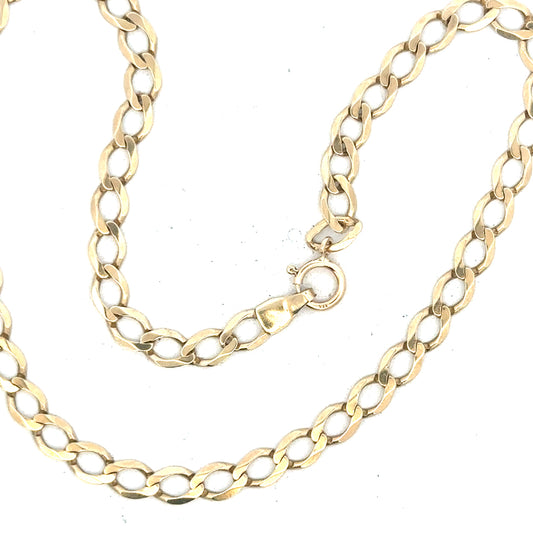 9ct yellow gold curb bracelet weighing 3.9g, unbranded jewelry piece with a classic chain design.