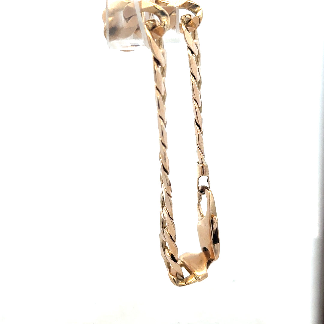 9ct yellow gold curb bracelet weighing 31.9g with a classic chain design, unbranded jewelry piece.