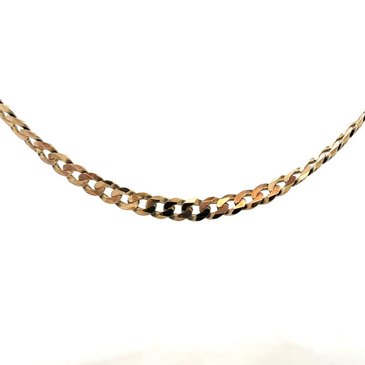 9ct yellow gold curb chain weighing 25.4g, featuring a classic linked design, photographed against a neutral background.