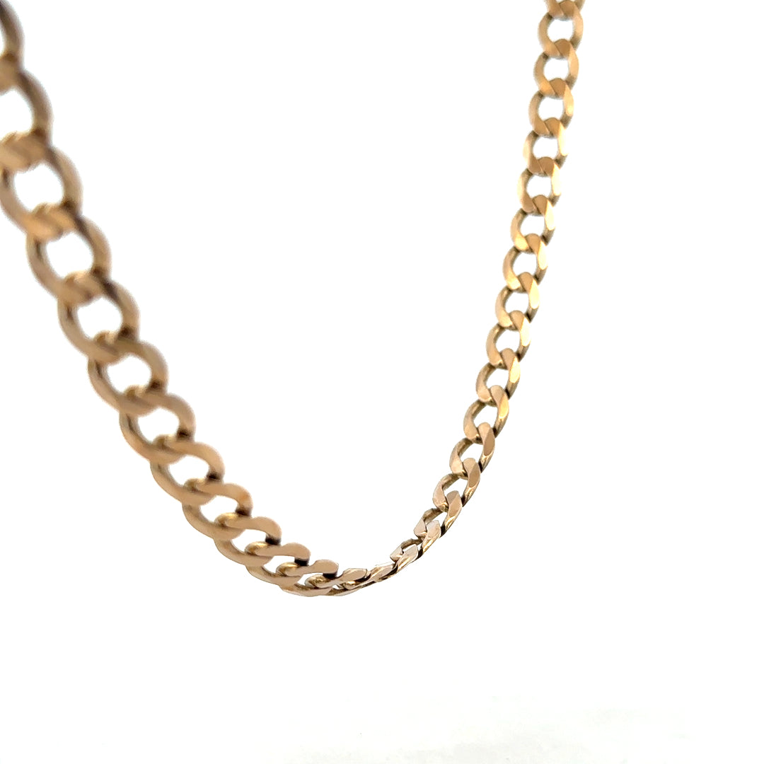 9ct yellow gold curb chain weighing 38.8g, featuring a classic linked design and polished finish.