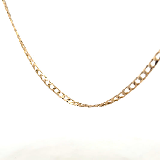 9ct yellow gold curb chain weighing 9.9g, unbranded jewelry with a classic linked design, displayed on a neutral background.
