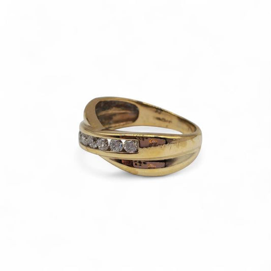 9ct yellow gold diamond crossover ring with sparkling diamonds, showcasing elegant design and craftsmanship.