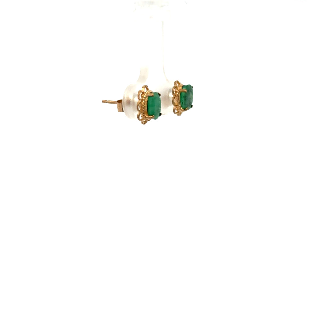 9ct yellow gold emerald earrings featuring vibrant green gemstones and a delicate design, weighing 0.9 grams.