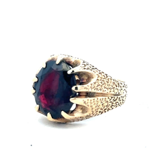 9ct yellow gold garnet ring in size N1/2 featuring a vibrant garnet gemstone and a polished gold band.
