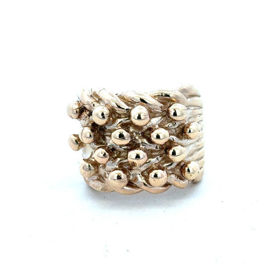 9ct yellow gold keeper ring in size W with a simple band design, unbranded jewelry displayed on a plain background.