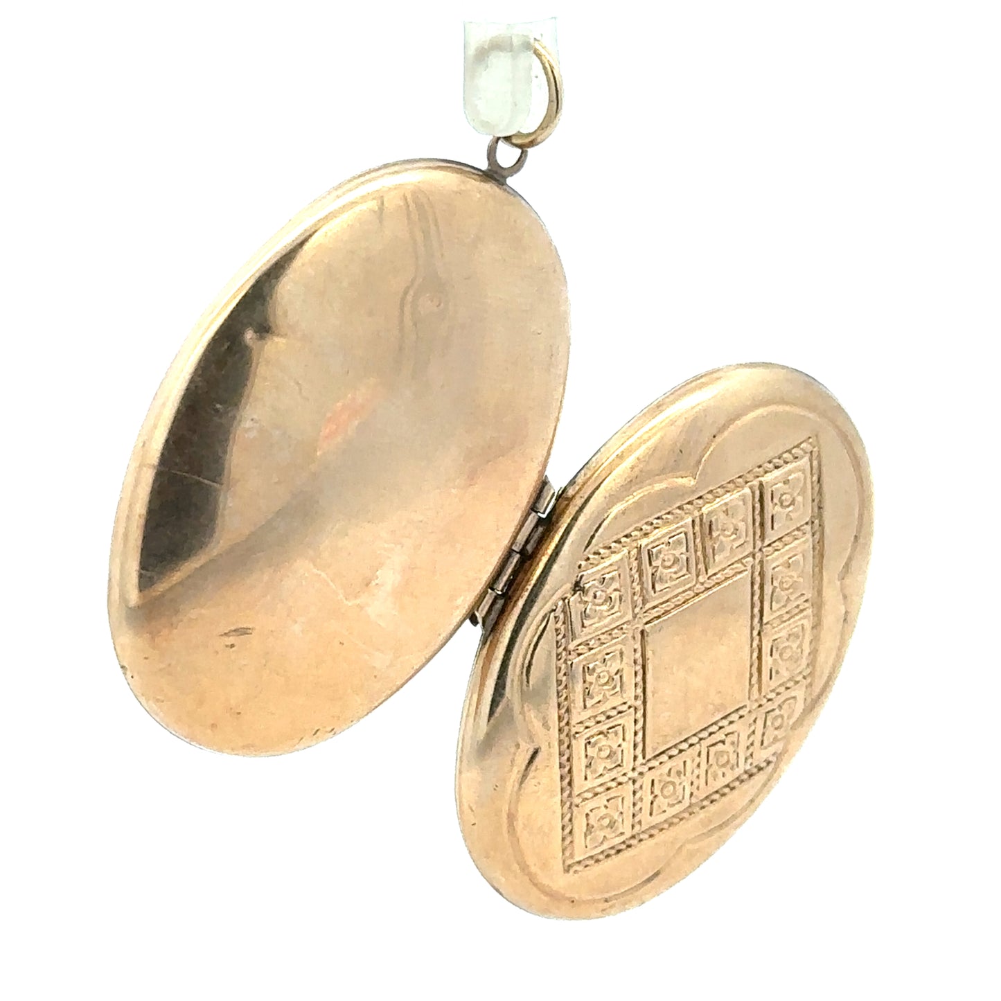 9ct yellow gold locket pendant weighing 5.8g, unbranded, featuring a classic design with a polished finish and intricate detailing.