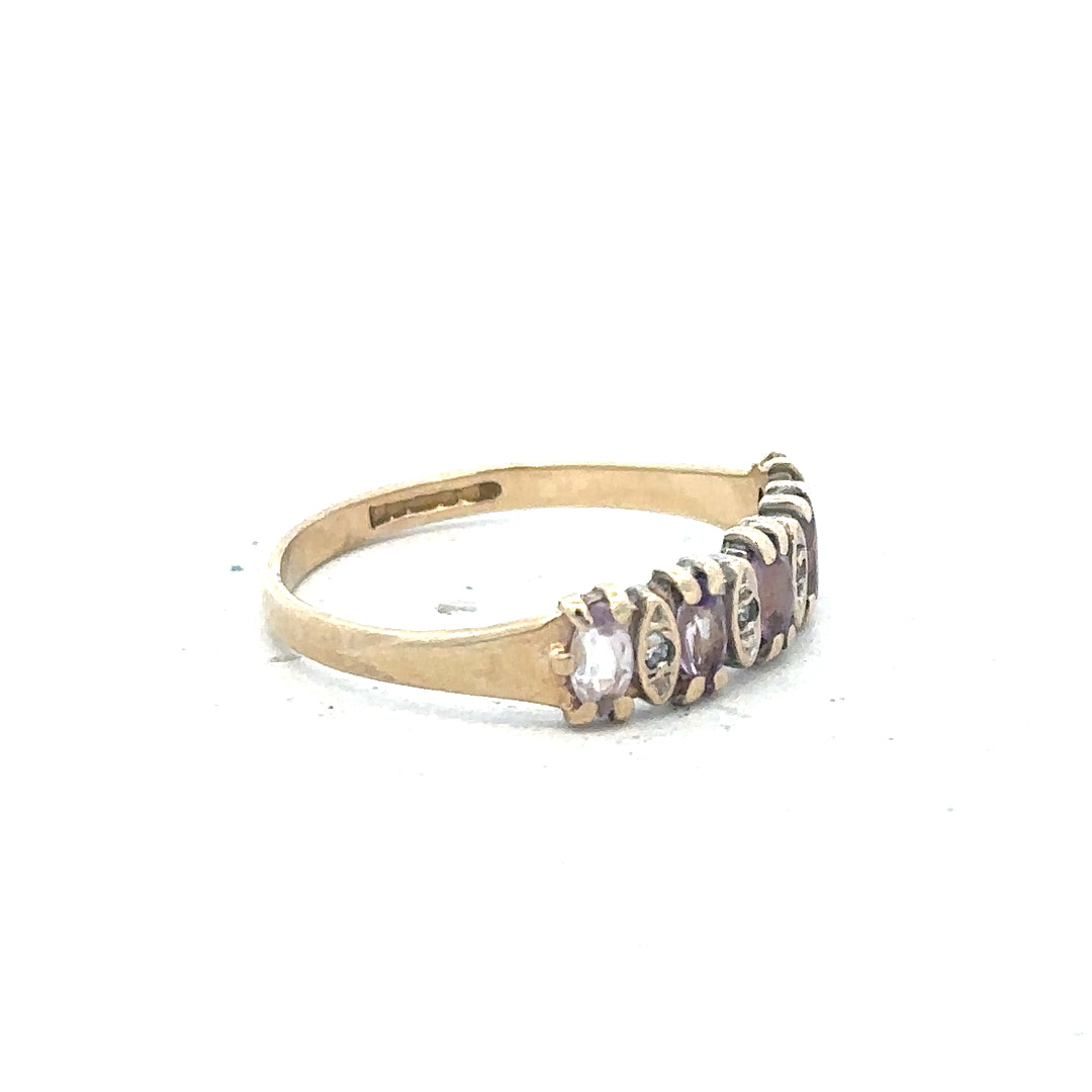 9ct yellow gold ring size K1/2, unbranded, with a smooth polished band shown in this close-up image.