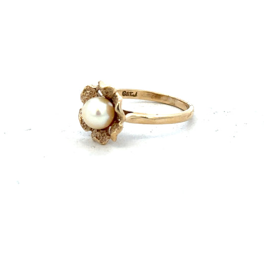 9ct yellow gold ring in size L with a simple band design, unbranded jewelry displayed on a neutral background.