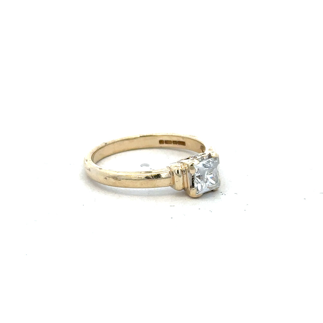 9ct yellow gold ring in size O with a simple polished band, unbranded jewelry displayed on a neutral background.