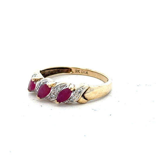 9ct yellow gold ruby and diamond ring, size L, featuring a central ruby surrounded by sparkling diamonds.
