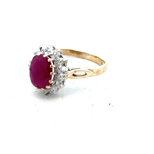 9ct yellow gold ruby and diamond ring in size L, featuring a central ruby surrounded by sparkling diamonds