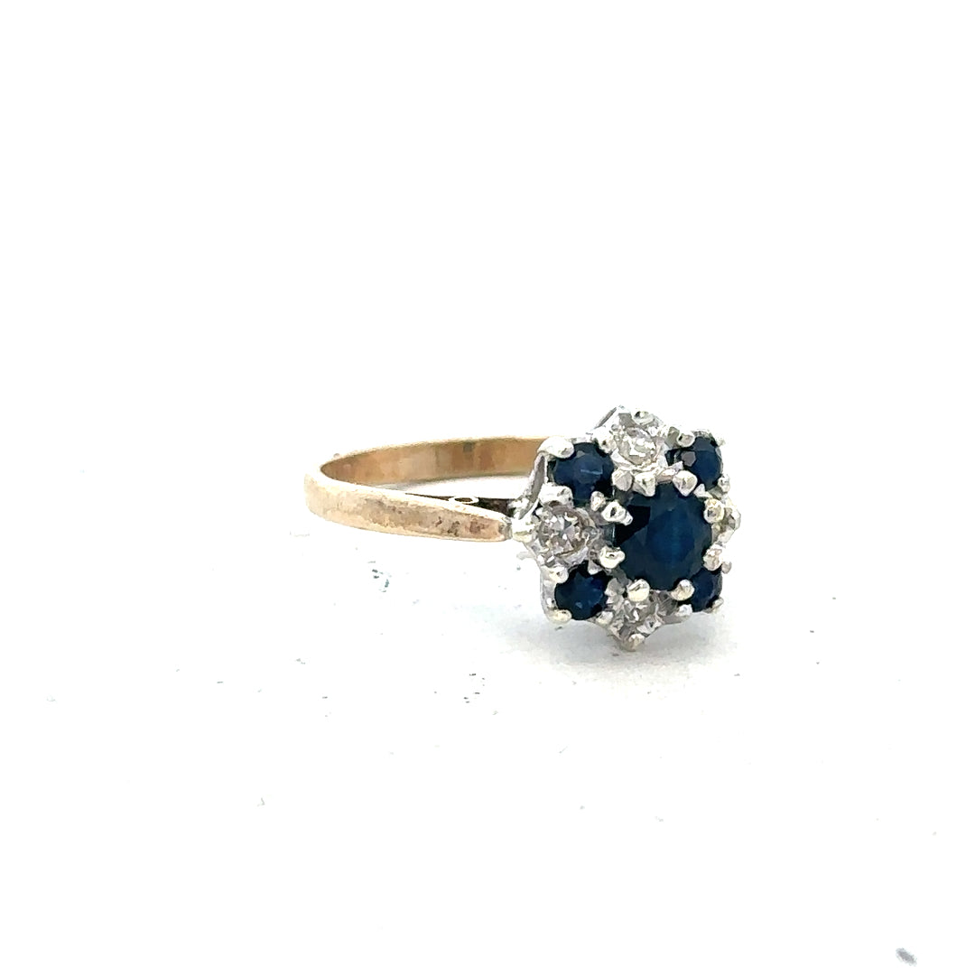 9ct yellow gold sapphire and diamond ring size P, featuring a central blue sapphire and sparkling diamonds.