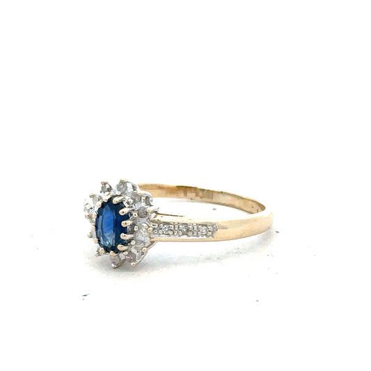 9ct yellow gold sapphire and diamond ring, size P1/2, featuring a central sapphire gemstone and sparkling diamonds.