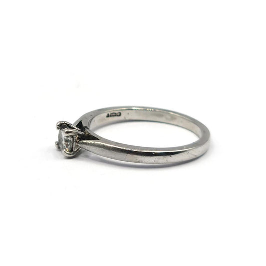 Platinum 0.30 carat solitaire brilliant cut diamond ring, close-up of the elegant engagement ring with a single sparkling diamond.