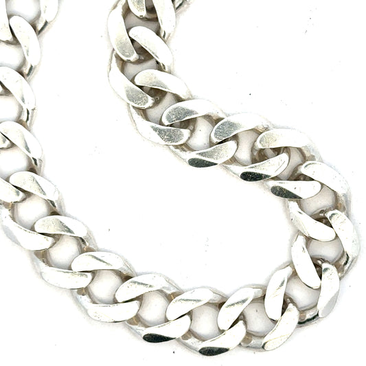 Silver curb bracelet weighing 33.7g, showcasing a sleek chain design with a polished finish, unbranded jewelry accessory.