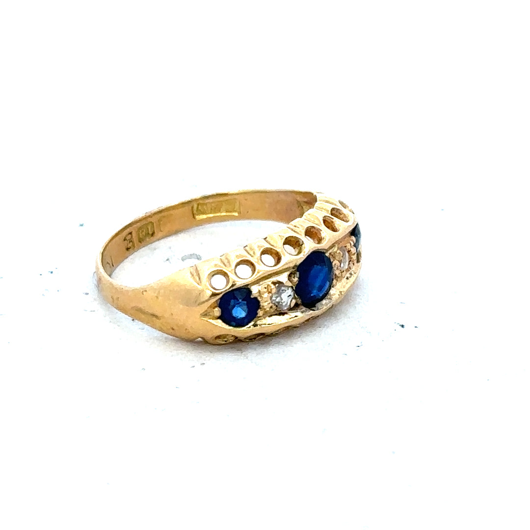 Vintage 18ct yellow gold sapphire and diamond ring with intricate design, showcasing vibrant blue sapphire and sparkling diamonds.