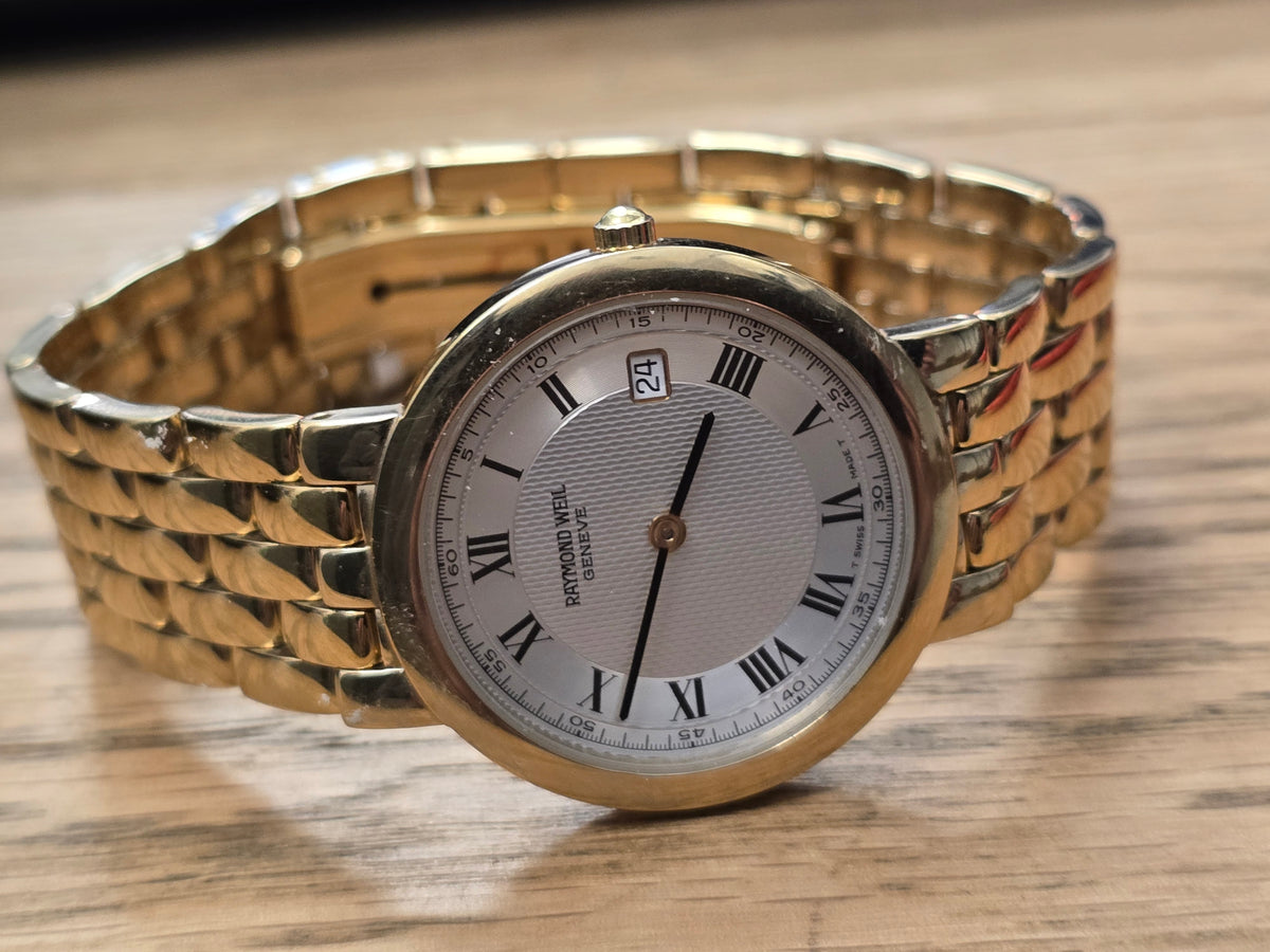 Raymond Weil Geneve gold-plated quartz watch with white Roman numeral dial and date display