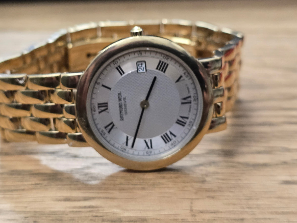 Raymond Weil Geneve gold plated quartz watch with white Roman numeral dial and date display