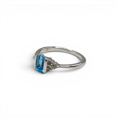 9ct white gold topaz and diamond ring by Reeves and Sons, showcasing a sparkling topaz center stone with diamond accents.