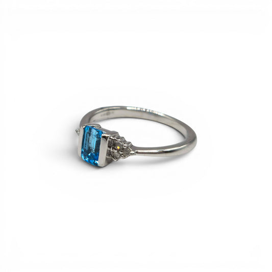 9ct white gold topaz and diamond ring by Reeves and Sons, showcasing a sparkling topaz center stone with diamond accents.