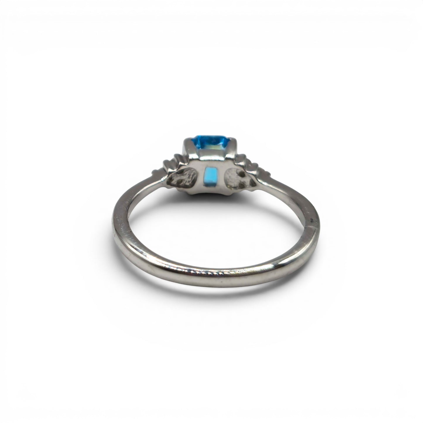 9ct white gold ring with blue topaz and diamond accents, Reeves and Sons jewelry, elegant gemstone and precious metal design