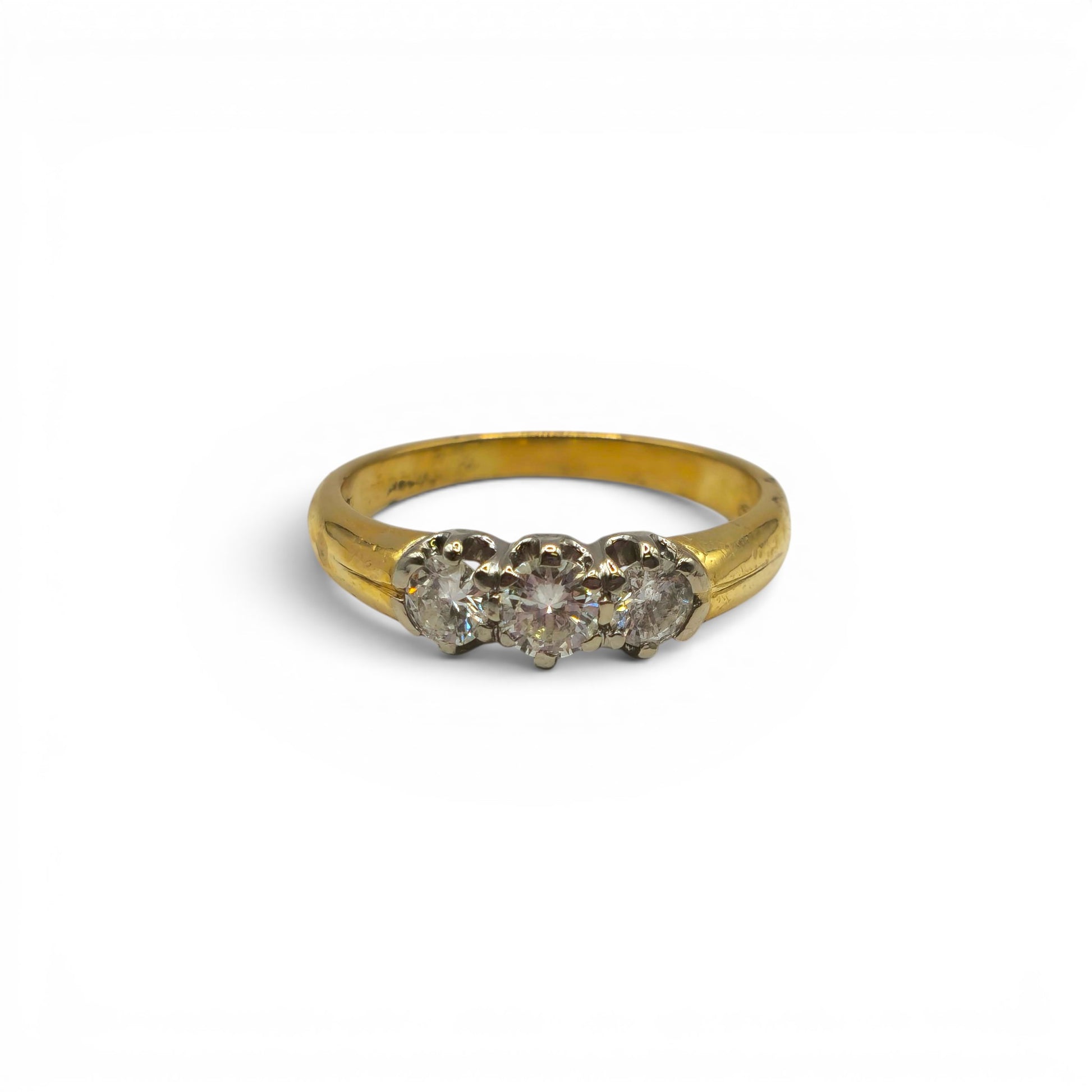 18ct yellow gold three stone diamond ring by Reeves and Sons, featuring a classic design with sparkling diamonds.