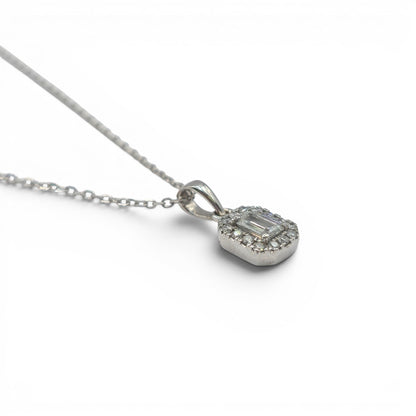 18ct white gold diamond cluster pendant with sparkling diamonds, crafted by Reeves and Sons, shown on a white background.