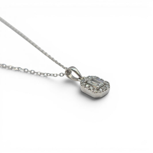 18ct white gold diamond cluster pendant with sparkling diamonds, crafted by Reeves and Sons, shown on a white background.