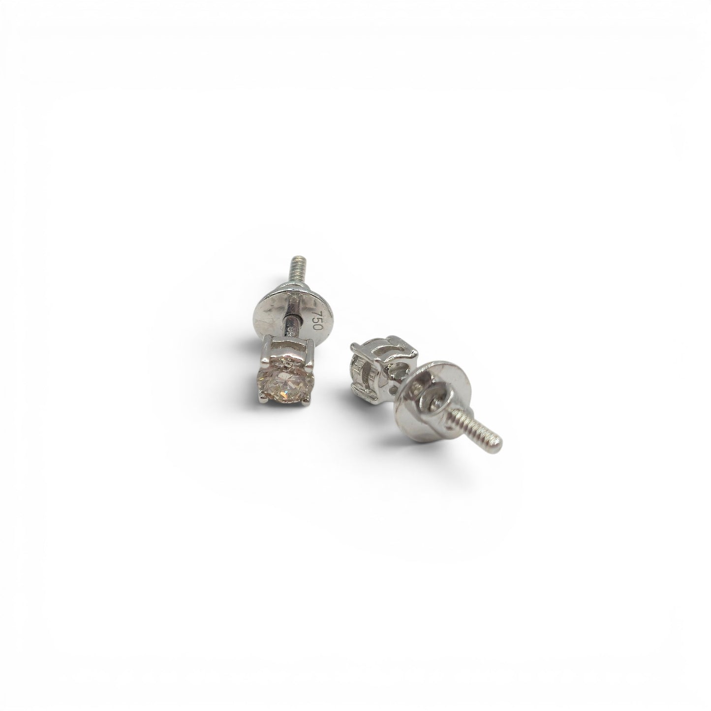 18ct white gold diamond stud earrings with sparkling diamonds, featuring a classic and elegant design by Reeves and Sons.