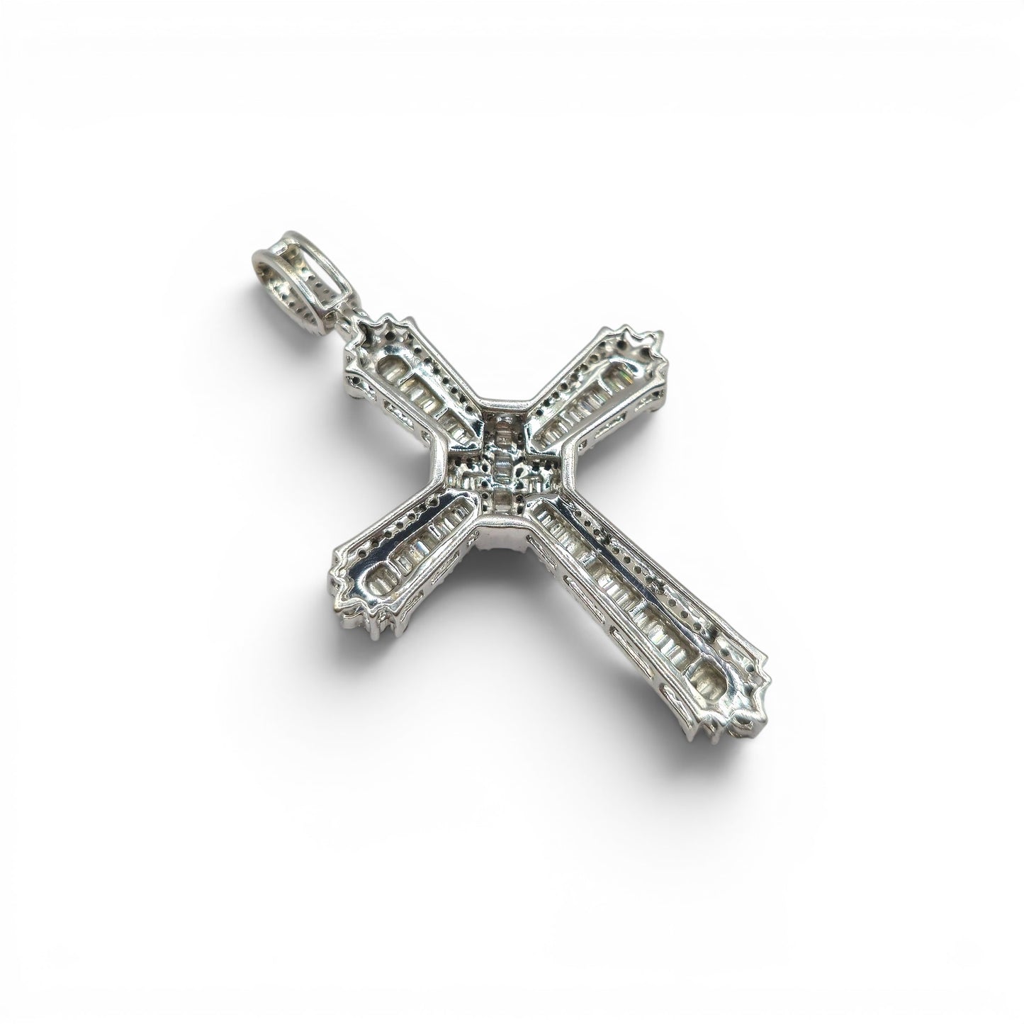 9ct white gold diamond cross pendant by Reeves and Sons, featuring sparkling diamonds on a sleek cross design.
