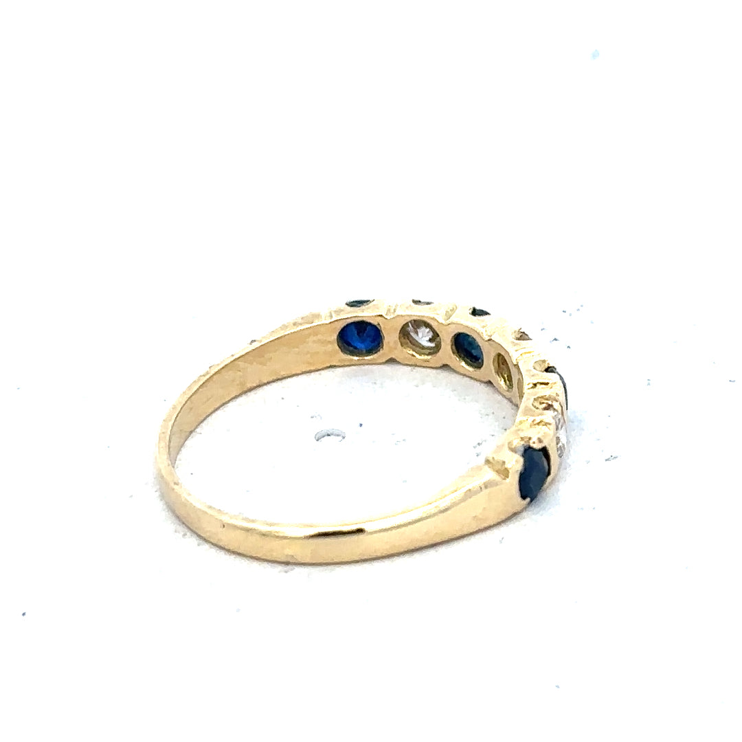 18ct yellow gold diamond and sapphire ring, size M 1/2, featuring a sparkling gemstone design and elegant band.