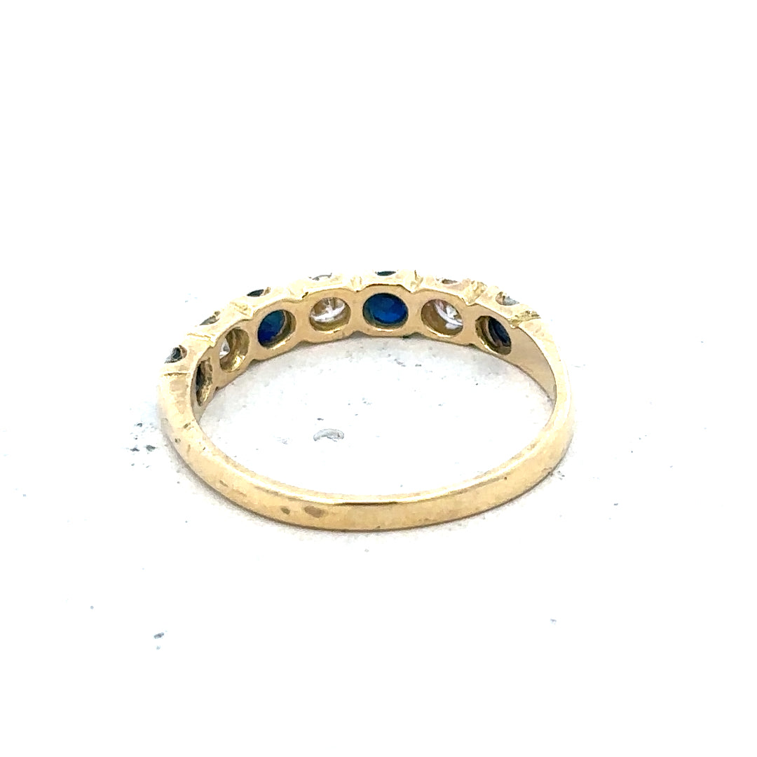 18ct yellow gold diamond and sapphire ring in size M 1/2, featuring a detailed gemstone and elegant band design.