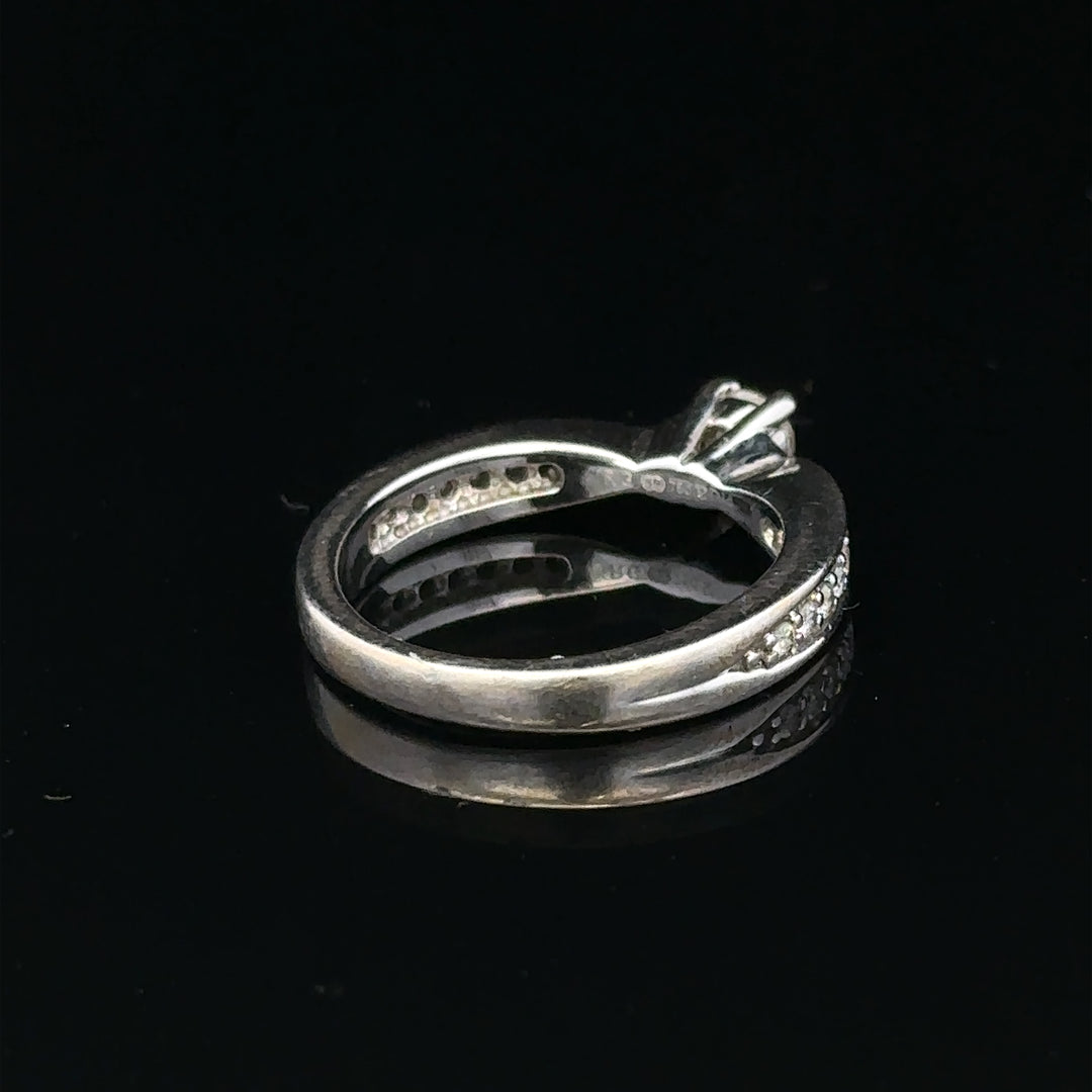 18ct white gold diamond ring with 1/3 carat total weight in size J, featuring a sparkling central diamond and elegant band.