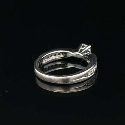 18ct white gold diamond ring with 1/3 carat total weight in size J, featuring a sparkling central diamond and elegant band.