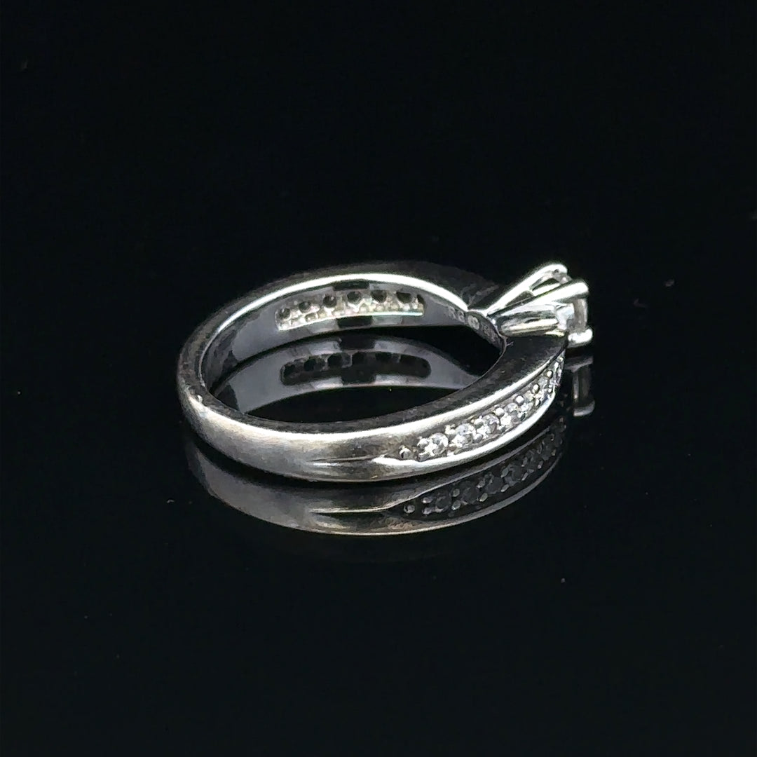 18ct white gold diamond ring with 1/3 carat center stone, size J, featuring a delicate sparkling design.